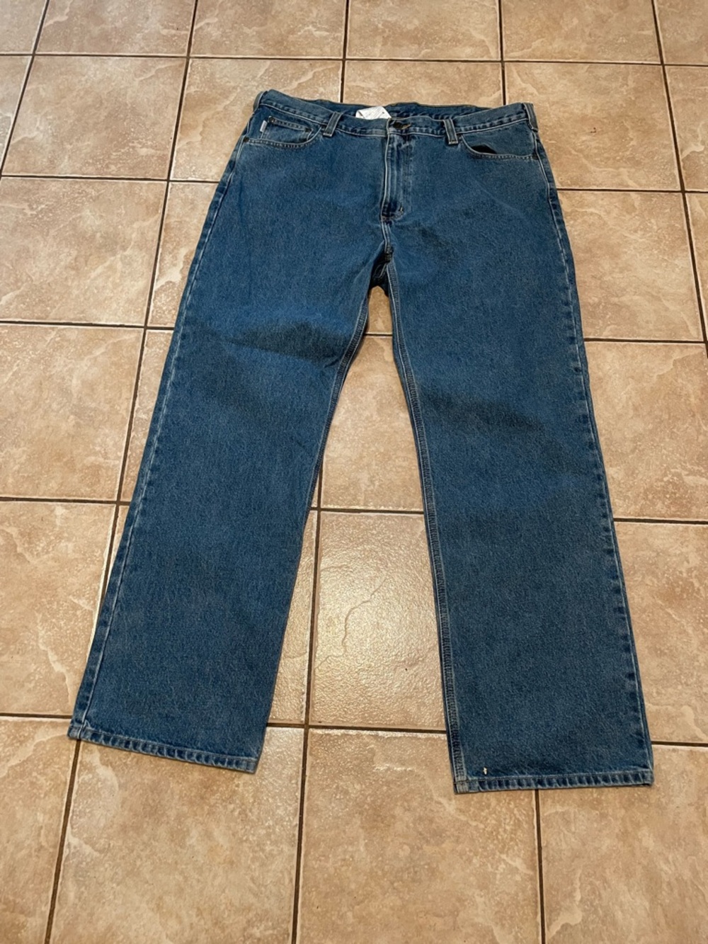Carhartt work jeans.  Loose fit. 40x 36